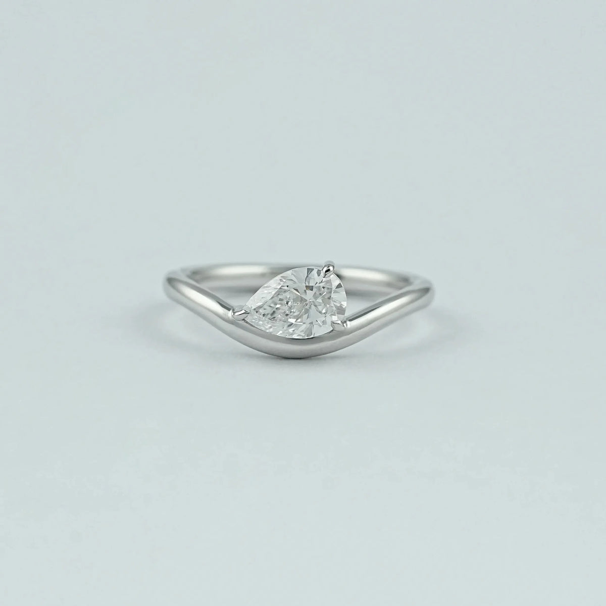 Pear Diamond Curved Engagement Ring