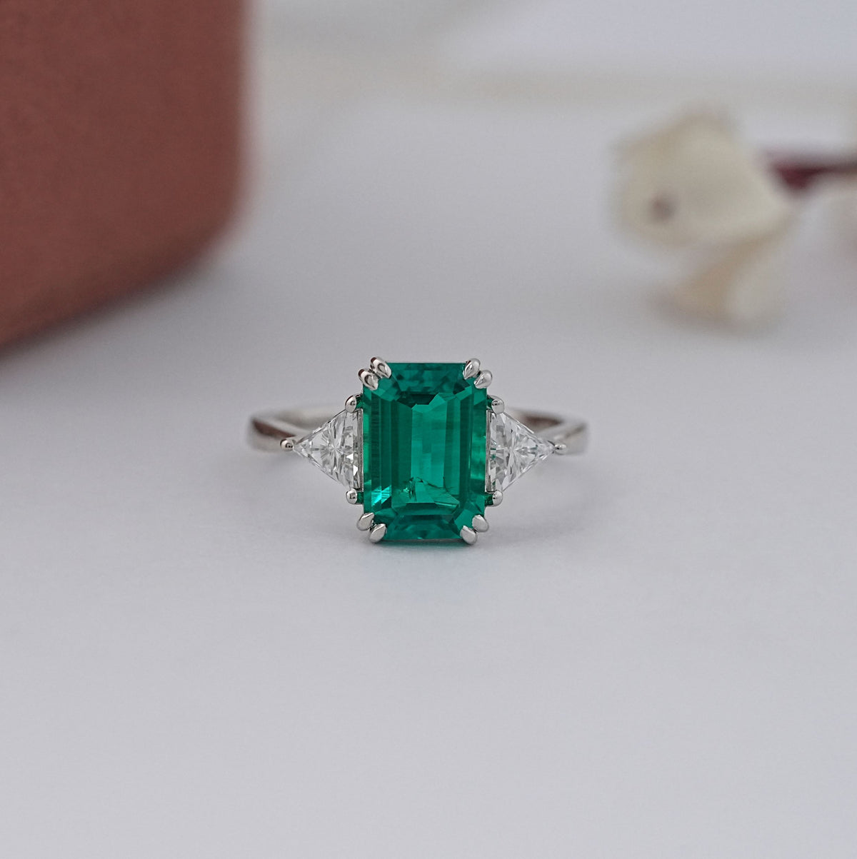 Emerald Gemstone And Triangle Cut Three Stone Ring