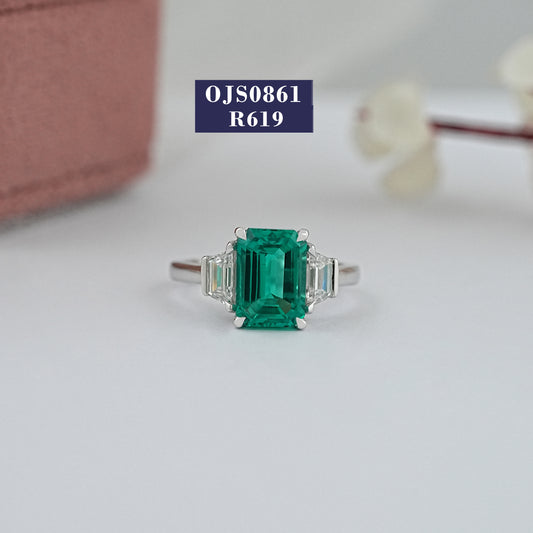 Green Emerald And Trapezoid Three stone Diamond Ring