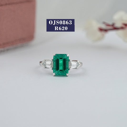 Green Emerald And Bullet Cut Three Stone Ring