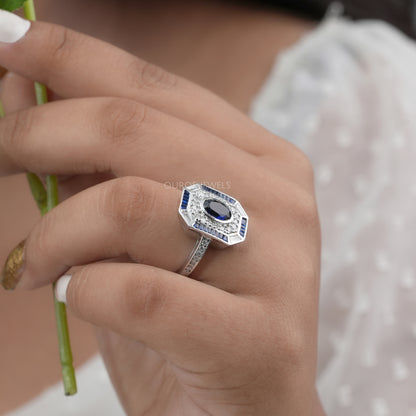 Blue Oval Cut Halo With Accent Diamond Ring